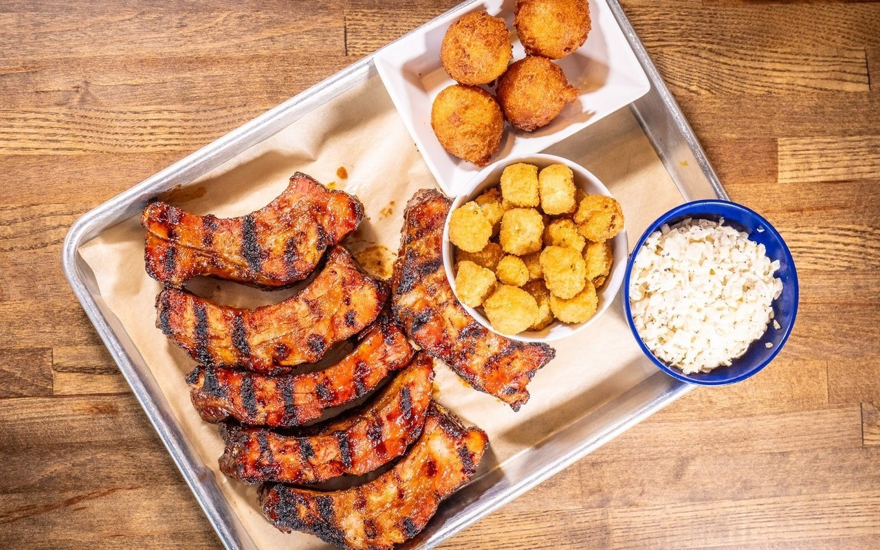 Rib tray with okra, white slaw, and hush puppies